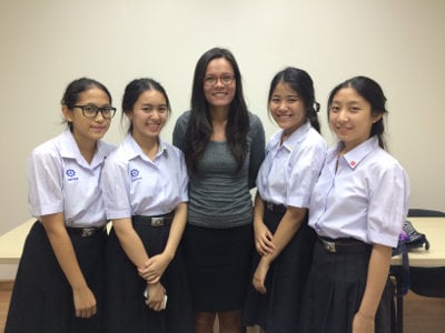 four students with a female Modulo French teacher